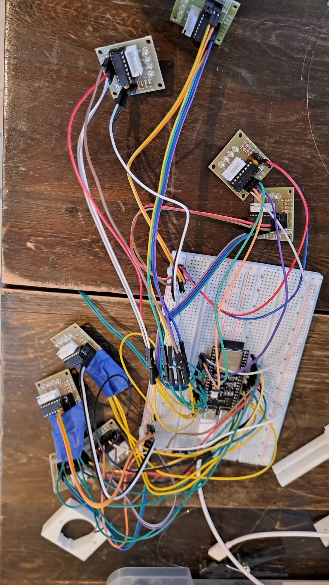 The ESP32-S3 on a breadboard, wired to the ULN2003 stepper driver boards.